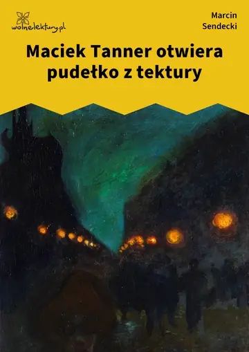 Maciek Tanner otwiera pudełko z tektury